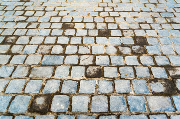 Old dirty blueish cobble stone pavementbackground image