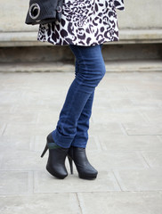 Girl's leg with black boots