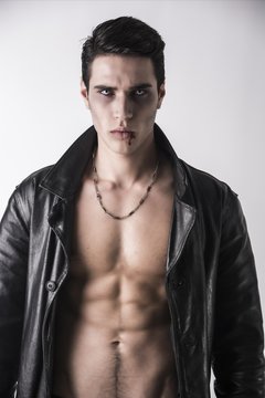 Young Vampire Man in an Open Black Leather Jacket, Showing his