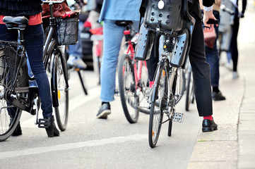 Fototapeta na wymiar Commuters on bikes waiting for green light
