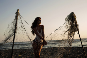 beach portrait behind fishing net