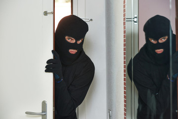 burglar thief at house breaking - obrazy, fototapety, plakaty