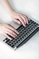 Fototapeta na wymiar Woman using modern laptop