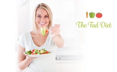 Good looking woman eating salad