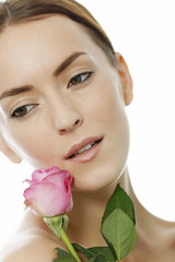 Woman holding a pink rose