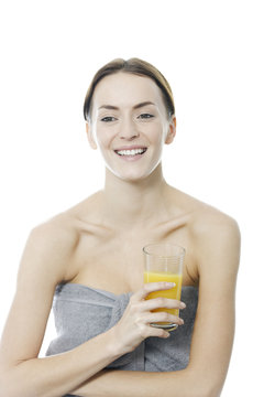 Woman holding a glass of Orange juice