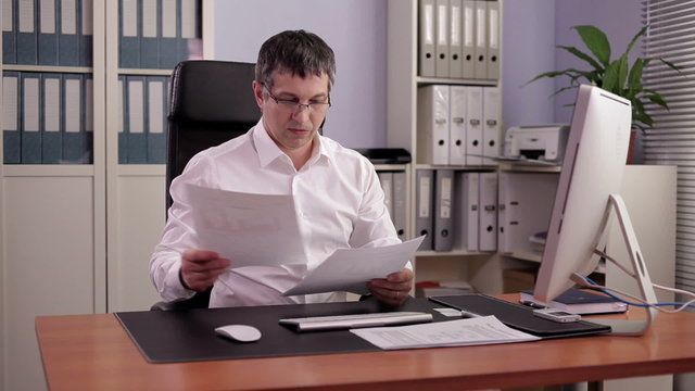 Financial Officer at Work/Financial Officer prepares a report