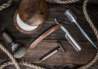 Shaving accessories on a luxury wooden background
