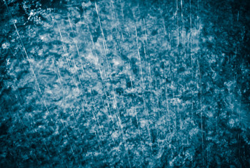 Heavy rain on water surface