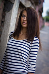 Fototapeta premium portrait of a cute girl in a t-shirt on the street