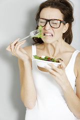 Woman eating fresh salad