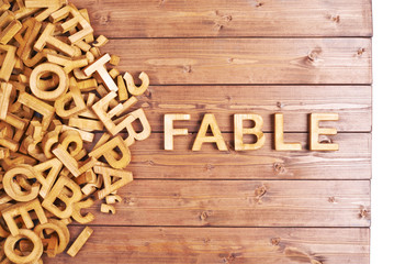 Word fable made with wooden letters