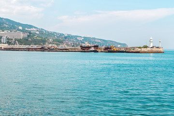 Fototapeta na wymiar Sea embankment and lighthouse in Yalta