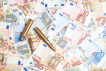 Few bullets over the pile of money