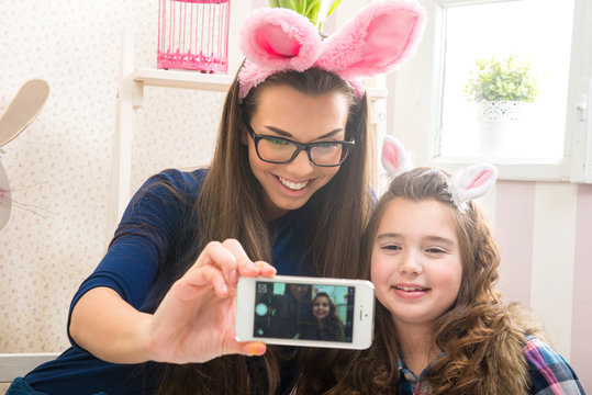 Easter - Mother and daughter with bunny ears, made Selfie photo