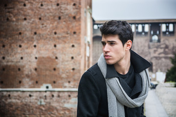 Young Man Outside the Building Looking Left