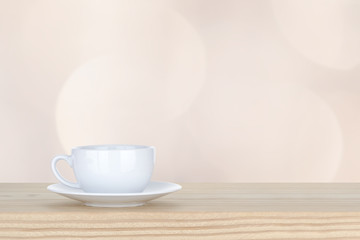 Fototapeta na wymiar white cup of coffee on pine Wooden Table and bokeh,defocused lig