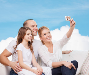 Obraz premium happy family with camera at home
