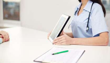 close up of doctor showing x-ray on tablet pc