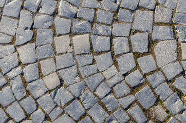 old pavement with a pattern of irregular stones