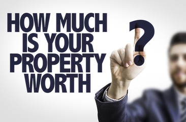 Business man pointing: How Much is your Property Worth?