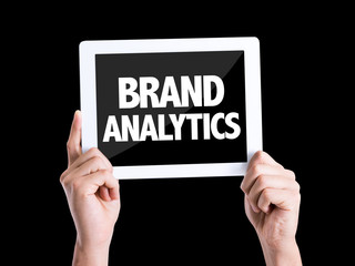 Tablet pc with text Brand Analytics isolated on black background
