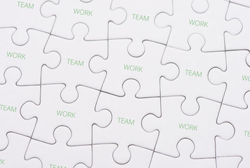 Puzzle pieces with text team work