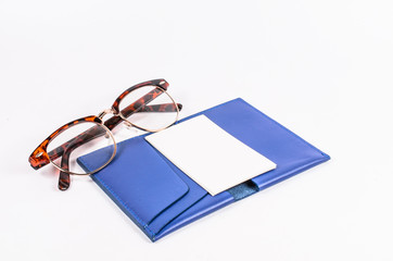 blank business name card on blue leather pocket with glasses