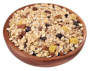 Musli in a wooden bowl on a white