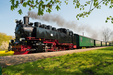 Obraz premium Historical German steam train in spring