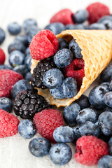 Fresh berries in waffle cone