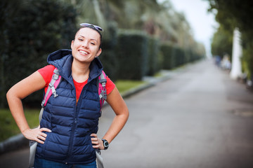 girl with a backpack in the alley