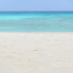 Fototapeta na wymiar White sand beach and sea background