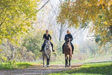 Girls  riding a horse
