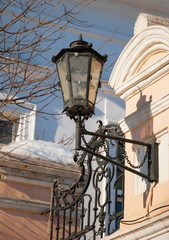 Fototapeta na wymiar Vintage wrought iron lantern decorated house
