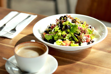 healthy salad and a cup of coffee for lunch