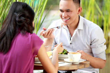 young couple have a lunch together