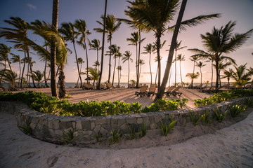 Fototapeta premium Beautiful tropical beach with silhouettes of palm trees