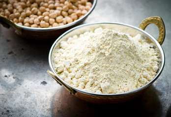 Flour from chick-pea in the Indian copper bowl