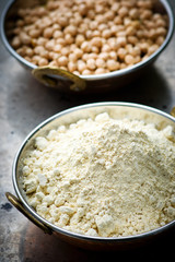 Flour from chick-pea in the Indian copper bowl