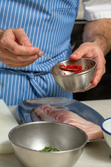 a chef preparing fresh fish