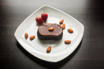 Dessert chocolate cake on a white plate.