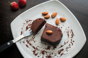 Dessert chocolate cake on a white plate.
