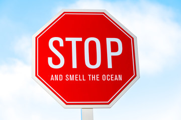"Stop and smell the Ocean" traffic sign in southern California