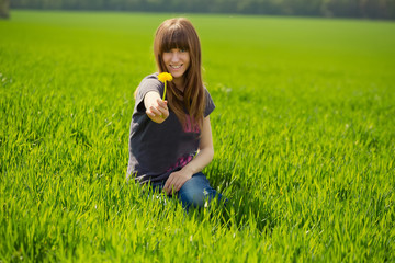 Fototapeta premium Beauty Girl in the Meadow. Beautiful Young Woman Outdoors. Enjoy