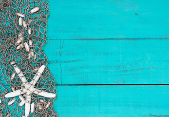 Blank teal blue sign with starfish and seashells in fish net border
