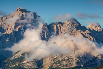Fototapeta premium Gruppo Del Cristallo mountain range at foggy summer morning