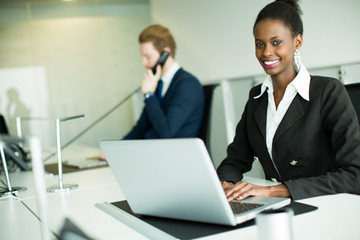 Fototapeta premium Young woman in the office