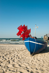Fisherman boat on a sandy shore