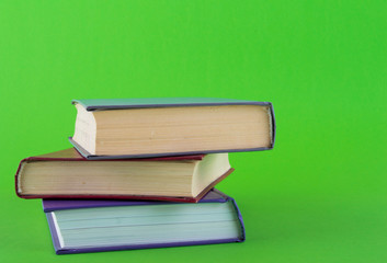 books on a green background